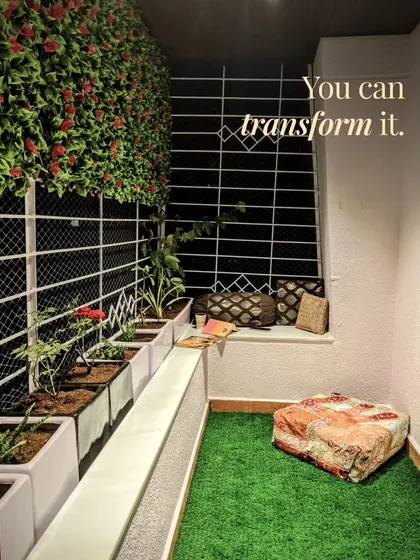 This cozy reading nook is proof that any balcony can be transformed. With artificial turf, planters, and a vertical flower wall, it's now a perfect spot to de-stress.
