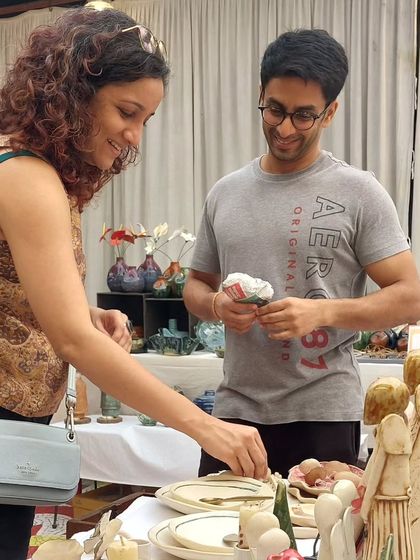 A couple browsing my tableware at the Studio Potters' Market. It's always interesting to see which pieces people are drawn to.
