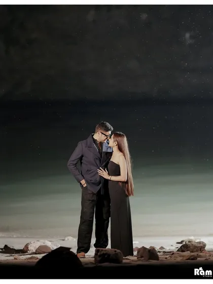A dramatic night shot by the Ganga river. The dark, starry sky and the vastness of the water create a powerful and romantic backdrop for this intimate couple portrait.