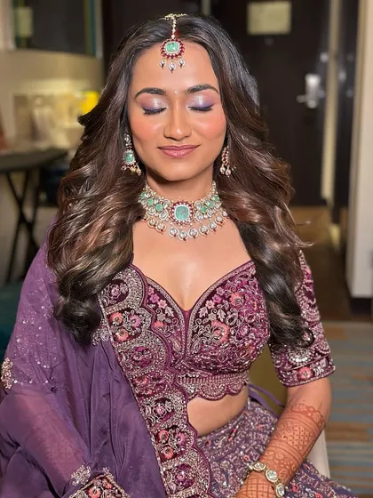 A serene, eyes-closed shot of the bride, her makeup and jewellery looking flawless.