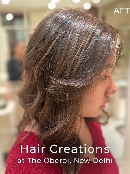 A side profile showcasing the soft, face-framing effect of honey gold highlights on a textured cut. The colour adds warmth and brightness around the face.