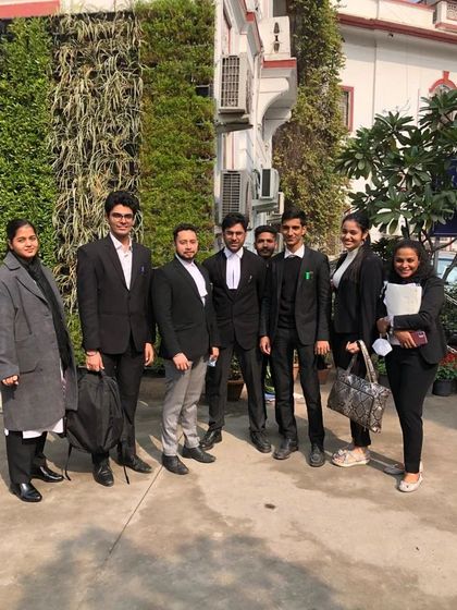 The team outside the court, a mix of senior and junior advocates ready for the day's work.