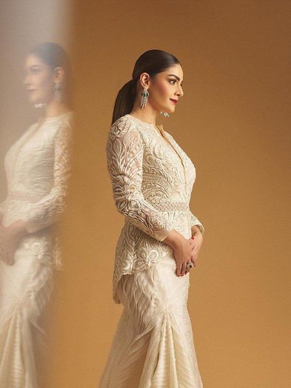 A side profile of the client, her reflection adding an artistic touch to the shot.