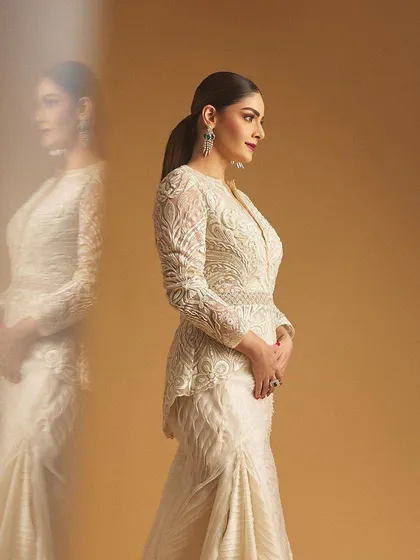 A side profile of the client, her reflection adding an artistic touch to the shot.