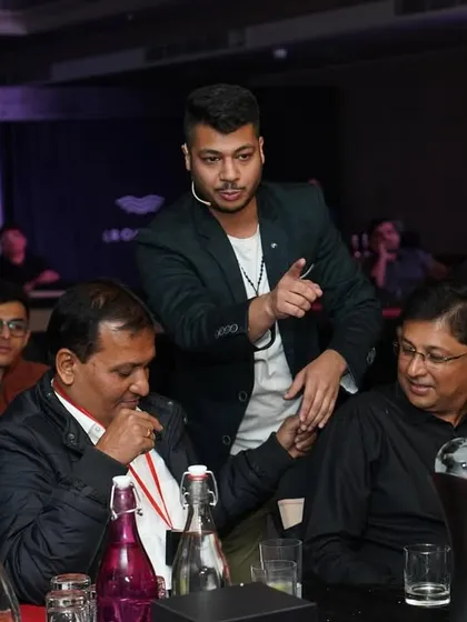 Performing strolling magic for guests at a corporate event for Lixil. I move from table to table, ensuring everyone gets a front-row seat to the impossible.