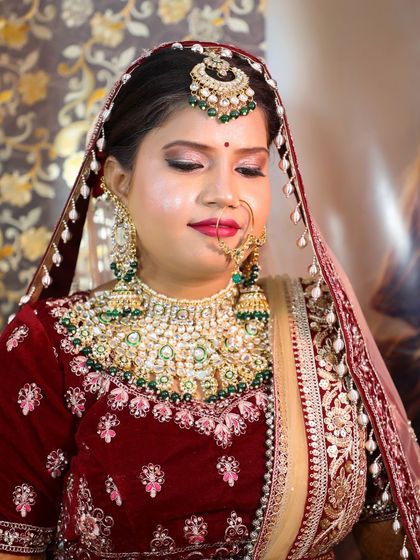A close-up of the bride from the previous video. You can see the soft shimmer on her eyelids and the clean, blended skin work.
