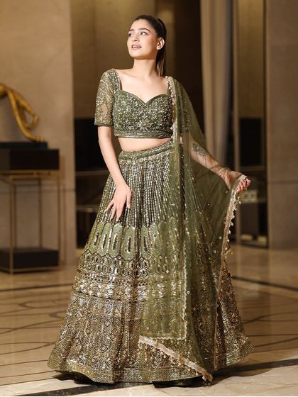 Another stunning view of the olive green lehenga, perfect for showing off its intricate details in your event photos.
