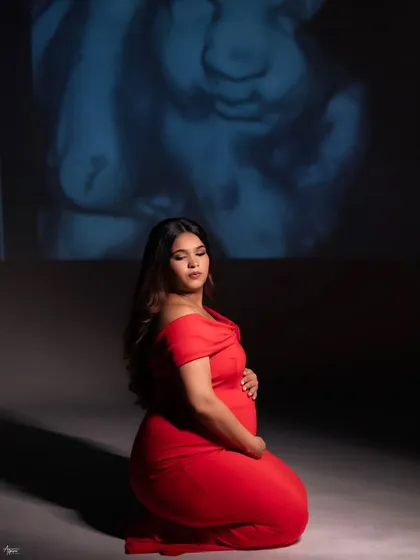 In the quiet of the studio, we projected her baby's sonogram, the very first picture, onto the wall. It’s a powerful and deeply personal way I help mothers connect with the little life they are nurturing. This is more than a portrait; it's a conversation before the first hello.