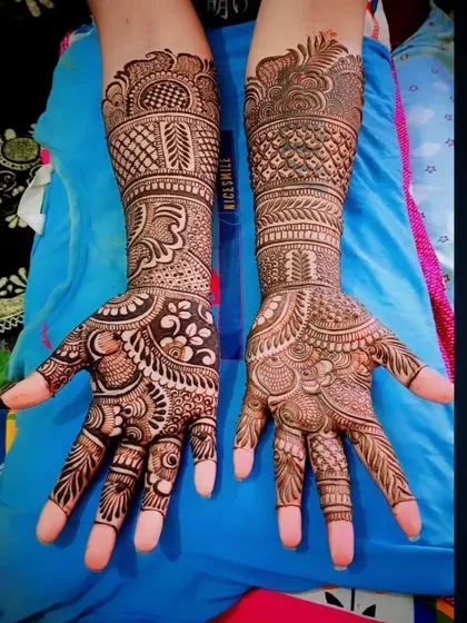 Another angle of the same dense and detailed traditional henna design.