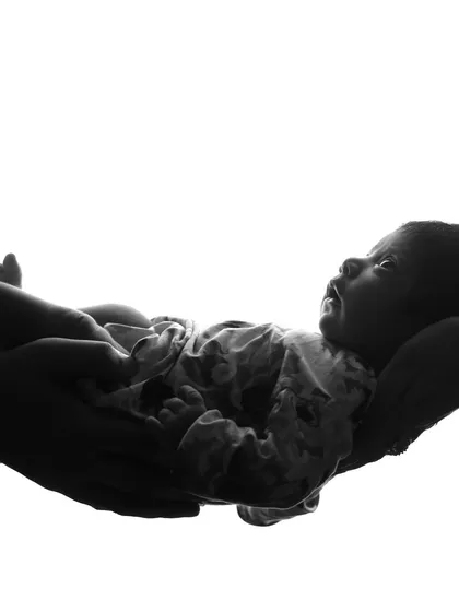 A simple and powerful silhouette of a parent holding their newborn. These black and white shots are timeless and focus purely on the connection and emotion.