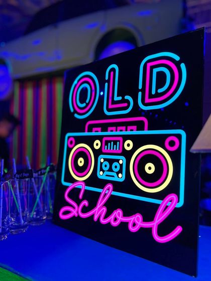 A custom "Old School" neon sign featuring a boombox design. These signs are a core part of our neon themes, adding a personalized and vibrant touch to the bar area.