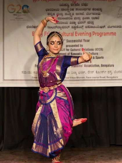A full-length shot of Anushree in a dynamic pose during her solo recital.