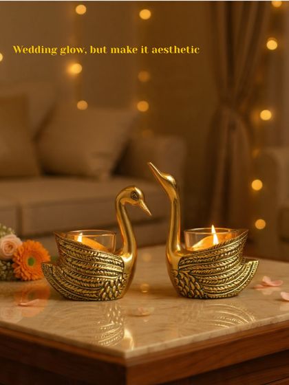 A symbol of love and togetherness, these brass swan t-light holders are a beautiful addition to any wedding decor, bringing a soft, romantic light to the occasion.