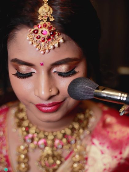 A close-up of the final touches on a bride. This unfiltered shot highlights the clean application of eye makeup and the smooth skin finish, which are hallmarks of my teaching style.