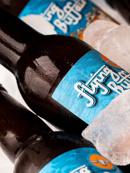 Another angle from the beer-on-ice series, this time with a more dramatic, shadowy lighting that gives it a premium feel.