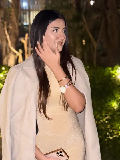 Adding a trench coat over the gown for a chic, layered look.