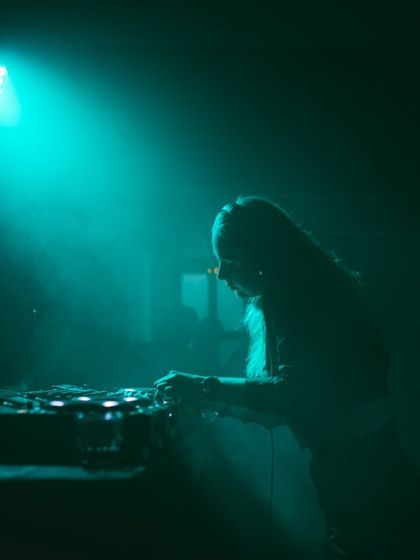 A silhouette shot under a single teal spotlight. I love how lighting can completely change the mood of a set.