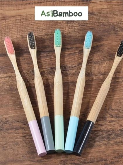 A lineup of our bamboo toothbrushes, showcasing the variety of colored handles and bristles available. These brushes offer an eco-friendly and stylish alternative to plastic, allowing you to personalize your sustainable choice.