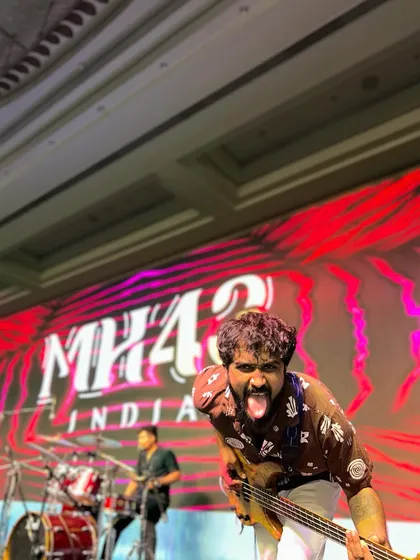 A little bit of fun and madness on stage is our signature. Our bassist showing his playful side during the Saraswat Bank annual conference.