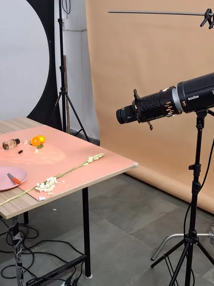 A close-up of our lighting equipment, showing the projector we use to create interesting shadow effects for our fragrance shoots.