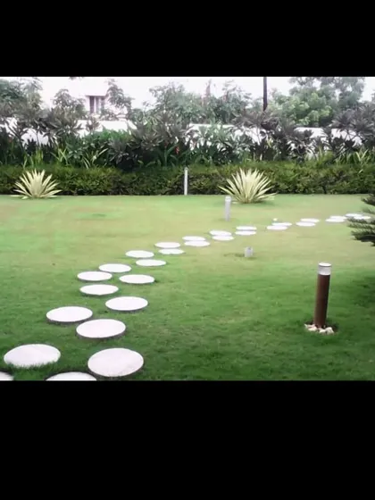 For a more modern or playful feel, we can install a winding path using round stepping stones. This design adds a unique touch to any lawn.