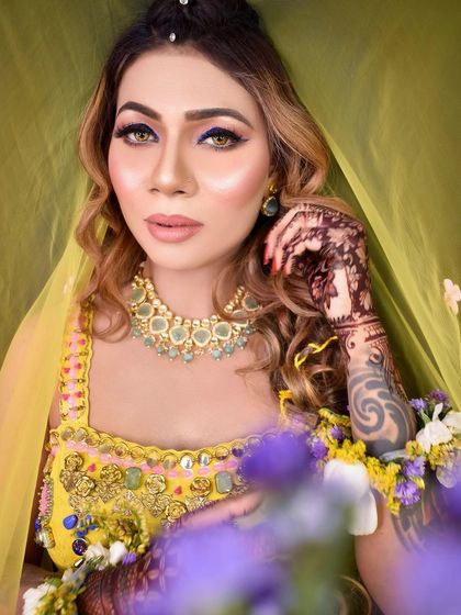 A close-up of this glamorous Mehendi look. The glowing skin and defined eyes are perfect for a bride who wants to make a statement.