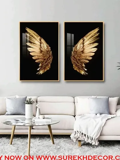 A bold and iconic set of two crystal paintings depicting golden angel wings against a black background. This powerful diptych creates a dramatic and inspiring statement piece for any room.