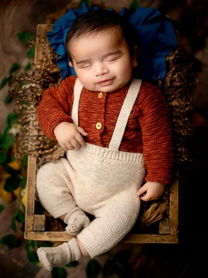 A sleepy smile captured in the moment. These little expressions are fleeting, and I'm always ready to photograph them.