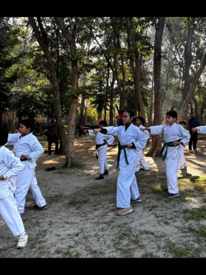 A group of our youth karate students practicing their punches in unison. This drill builds precision, timing, and discipline.