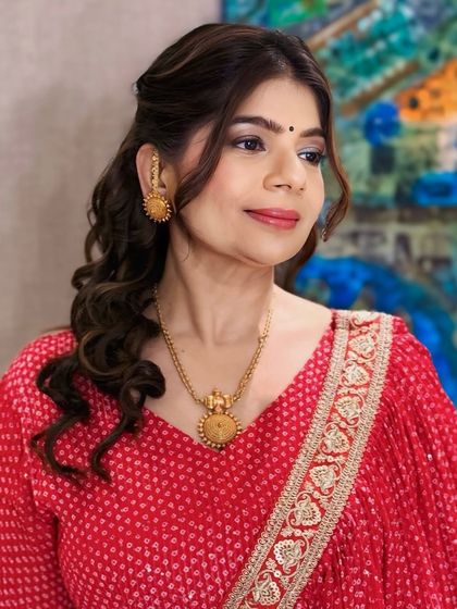 Our client looks fresh and elegant with her softly curled hair and natural makeup. This versatile style is suitable for a wide range of events, from formal to casual.