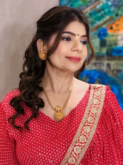 Our client looks fresh and elegant with her softly curled hair and natural makeup. This versatile style is suitable for a wide range of events, from formal to casual.