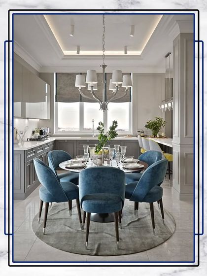 Welcome to your new sanctuary. This stunning dining room setup, with its plush blue chairs and modern chandelier, is ready to host countless cherished moments.