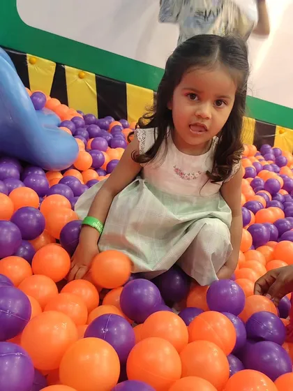 This little girl is having a wonderful time in our ball pit. It’s a great sensory experience and a perfect place for kids to play together.