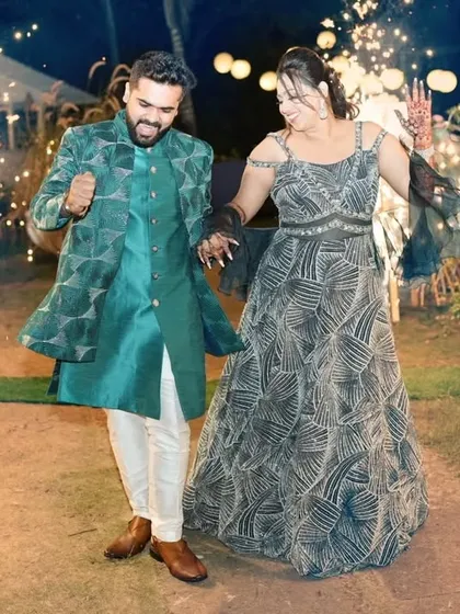 This is the energy I design for. A happy client making a grand entrance at his sangeet in a custom teal Indo-Western jacket. The geometric pattern and confident fit are made for movement, celebration, and owning the dance floor.