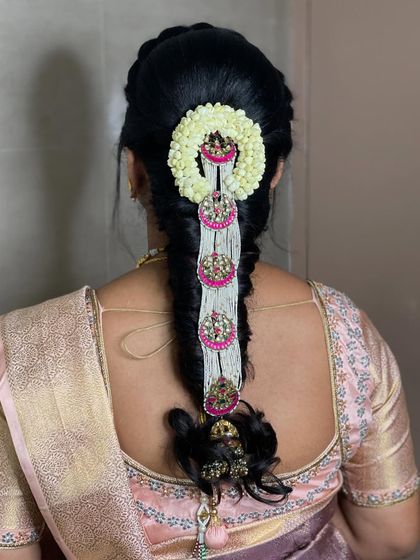 A close-up of the hair accessories used in Swathi's braid, showing how they add a unique and personal touch to the hairstyle.