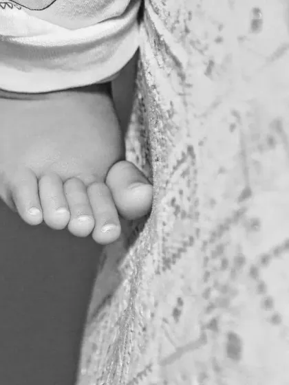 A detailed black and white shot of a baby's tiny toes. These close-up images are a beautiful way to remember just how small and perfect they were.