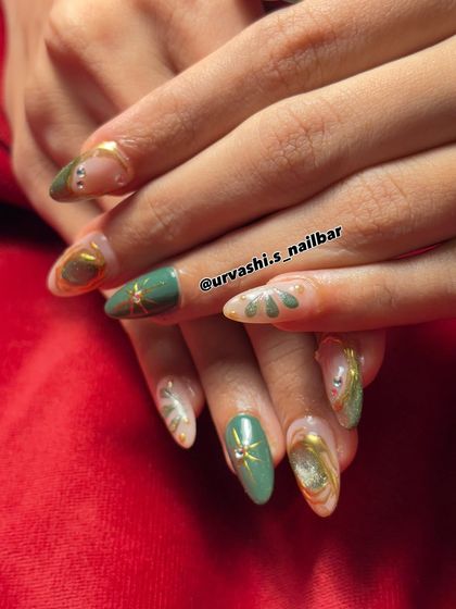 An artistic and elegant set in shades of green and gold. This design features a mix of solid color, abstract patterns, and gold detailing with rhinestone accents for a luxurious finish.