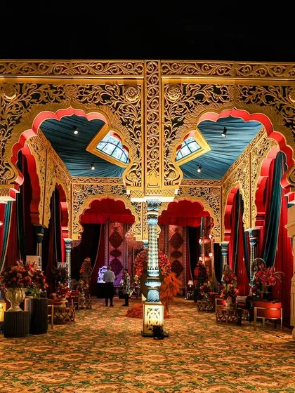 Inspired by the historic Durbar Hall of Mysore Palace, this grand entryway was built to leave guests spellbound. Flanked by majestic elephants, the jade-green and gold-gilded arches welcome guests into a living canvas of South Indian royalty and architectural splendor.