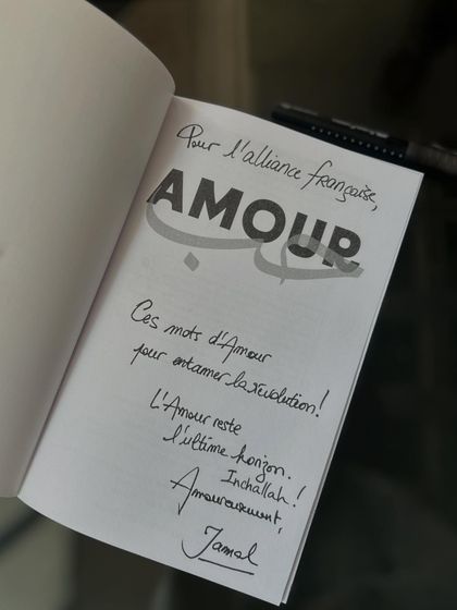 A heartfelt, handwritten dedication in a book by author Jamal Ouazzani. We cherish these personal connections with the authors who visit our library and share their work.