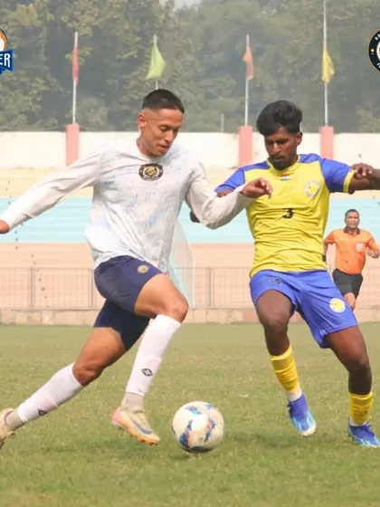 A physical battle for the ball, highlighting the strength and determination of our players.