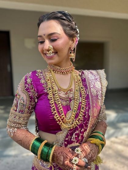 Another shot of the bride's complete look, from her makeup to her jewelry.