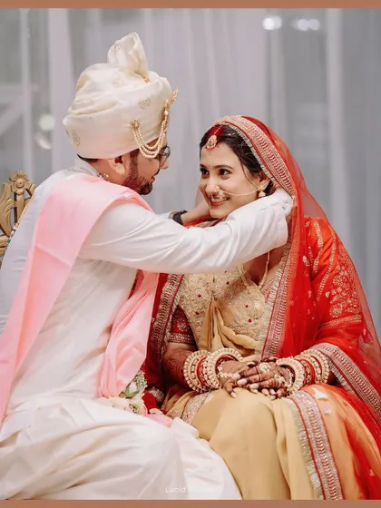 A tender moment between the bride and groom during their wedding ceremony.