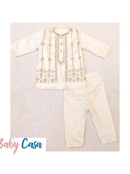 A detailed look at our embroidered off-white kurta pajama. The craftsmanship and quality of the fabric make it a luxurious choice for your little one.