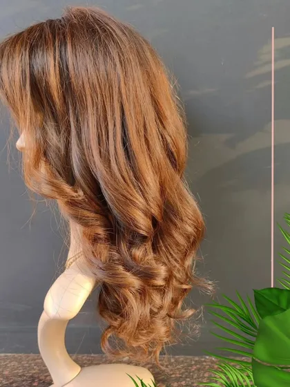 A beautiful, bespoke creamy blonde wig. We can create any color and style you can dream of.