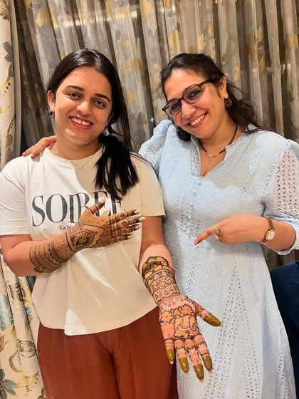 Here I am with Devisha, pointing at the intricate bridal mehndi. We were so happy that she trusted us with such an important event in her family.
