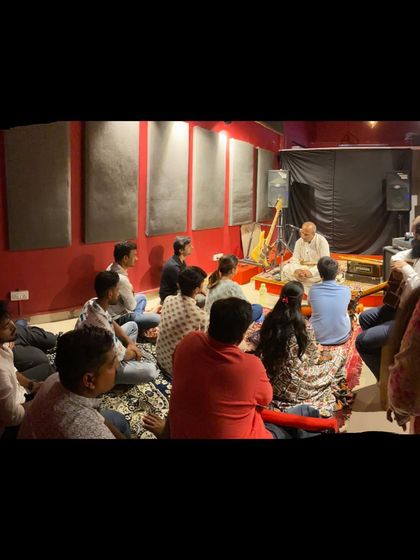 A wider view of our flute workshop, showing the intimate and focused learning environment we create. Students sit comfortably and get a close-up view of the instructor's techniques.