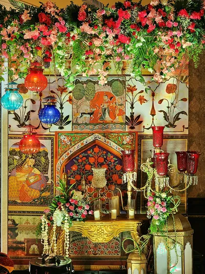Another angle of the detailed Sufi Night decor, showing the beautiful interplay of light, color, and texture. The combination of flowers, art, and traditional objects creates a truly immersive experience.