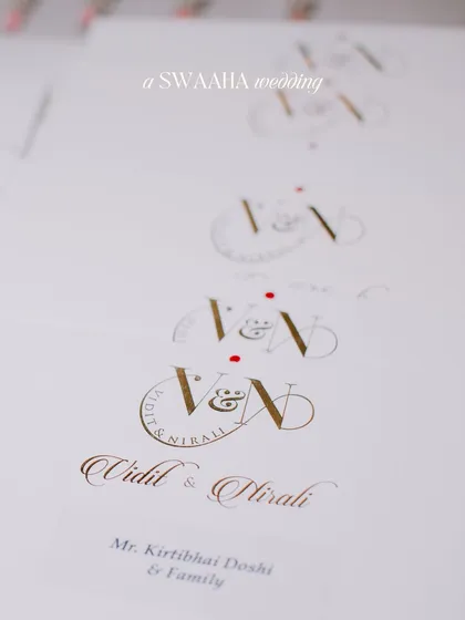 A shot of the elegant wedding stationery, featuring the couple's custom monogram.