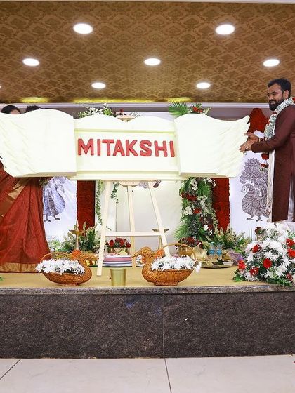 The family together on stage during the name reveal. These are the cherished moments that make all the planning worthwhile.
