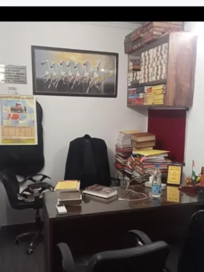 A view of my chamber, where strategy is formulated and cases are meticulously prepared. The extensive library and case files are a testament to our thorough research process for every matter we undertake.
